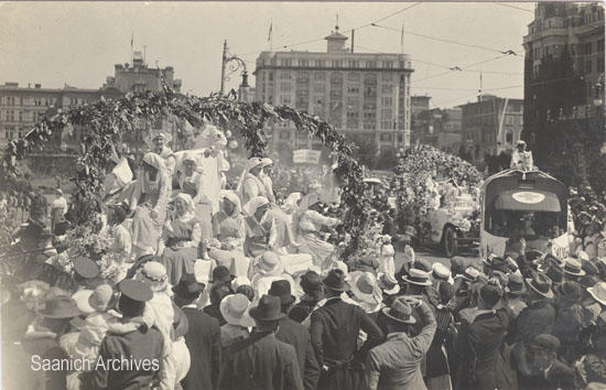 Postcard of Peace Parade, with the Red Cross float followed by Muggins, the Red Cross dog on top of an ambulance, July 19, 1919 (Saanich Archives 2015-028-012)