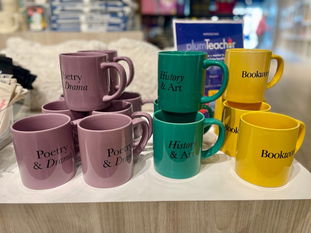 Mug display: “Poetry & Drama” “History & Art” “Bookworm”
