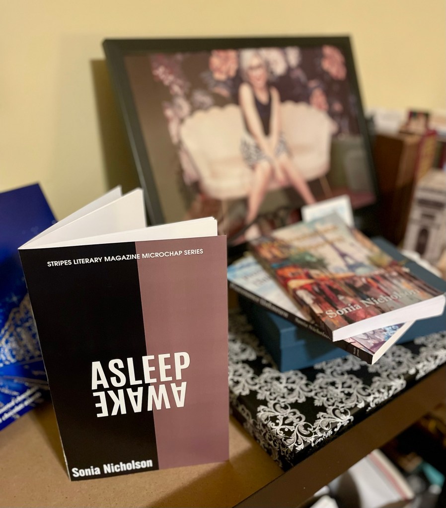 Book display including “Asleep/Awake” by Sonia Nicholson.