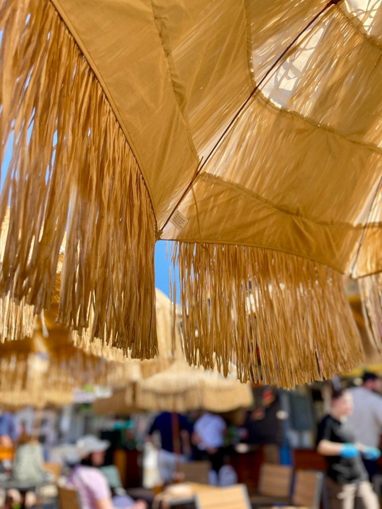Tropical umbrellas on a patio. Photo by author Sonia Nicholson. 