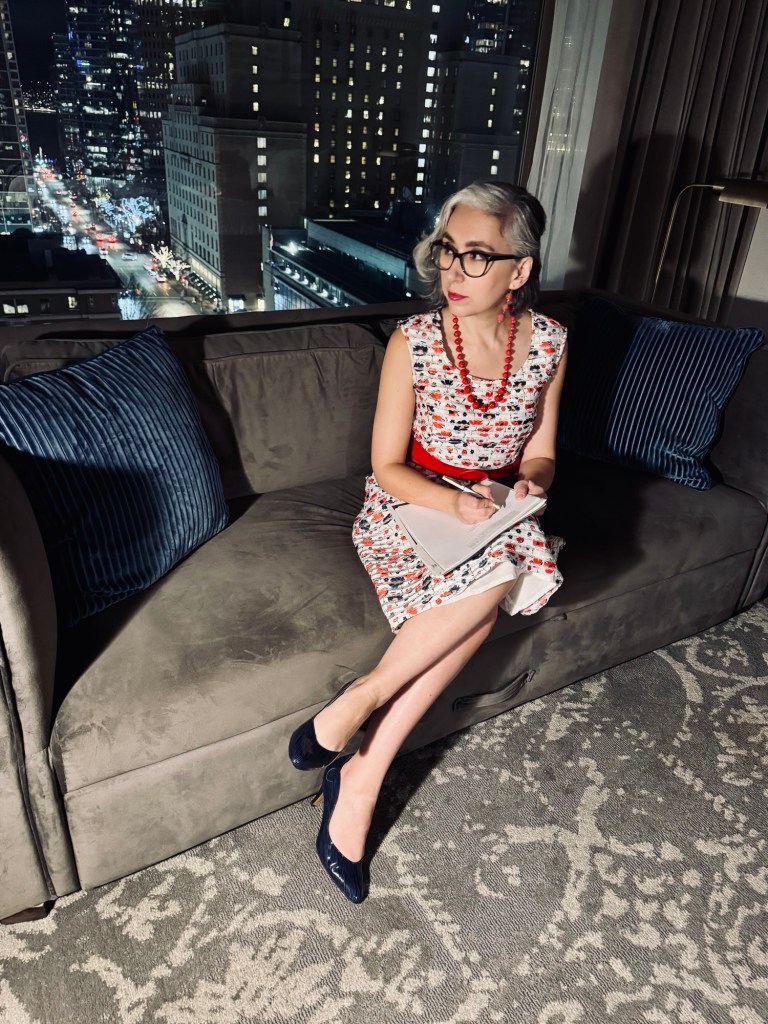 Author Sonia Nicholson signing agent contract in downtown Vancouver skyscraper, November 2024.