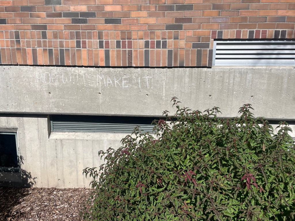 “You will make it” written in chalk on the side of a building.