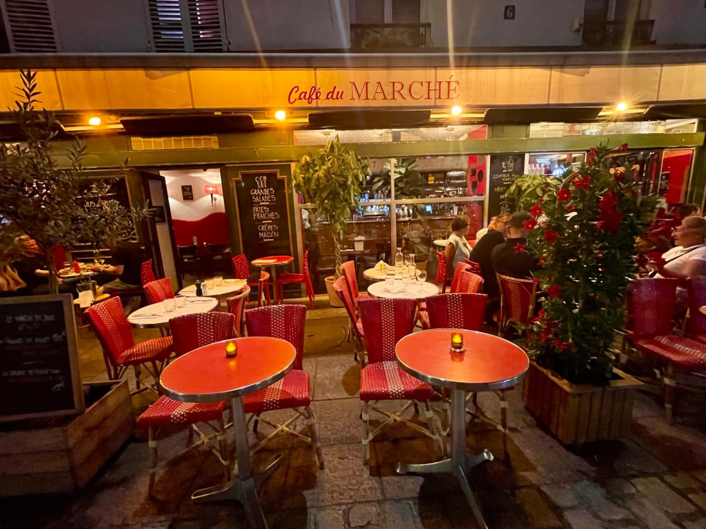 Paris cafe at night. Photo by author Sonia Nicholson.