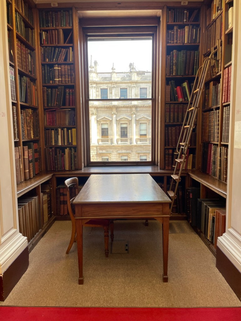 Library nook with ladder and window. Photo by author Sonia Nicholson.